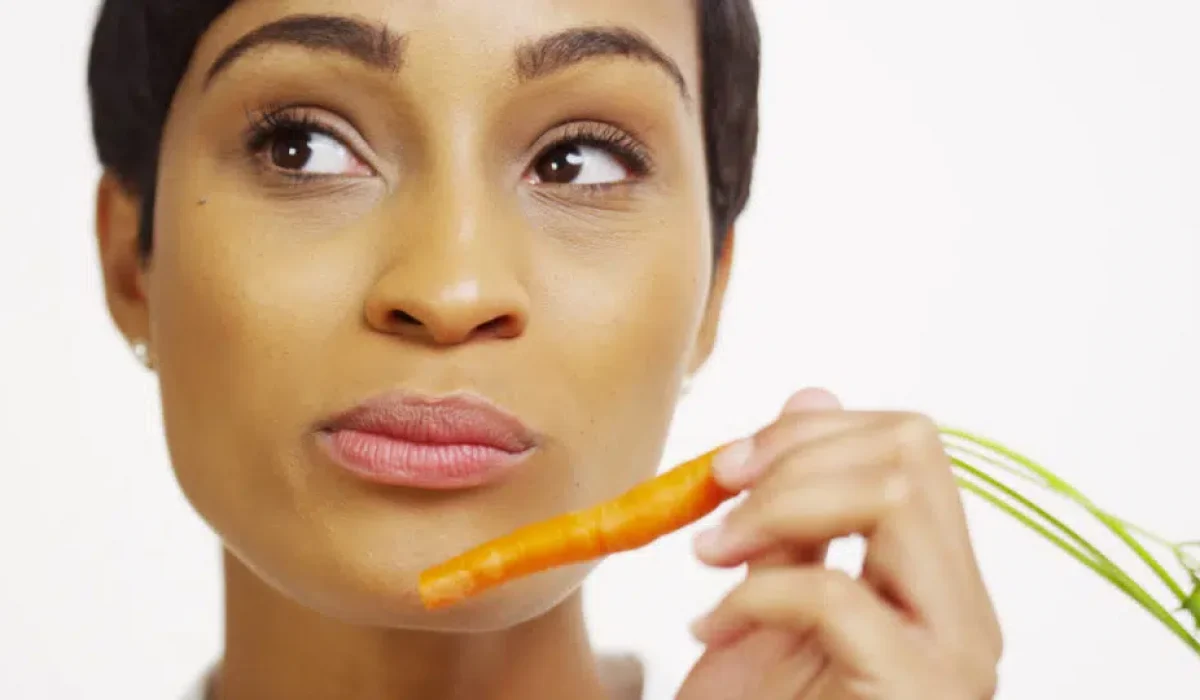 Woman Eating Carrots